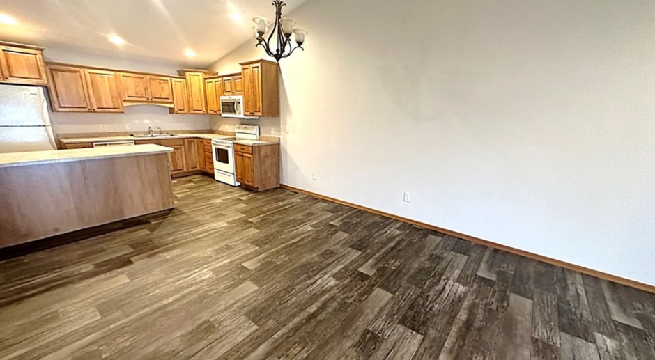 HARD TO FIND 4 BD, 2 BA TOWNHOME WITH DOUBLE ATTACHED GARAGE! PET FRIENDLY! SPACIOUS AND NEW UPDATES THROUGHOUT!