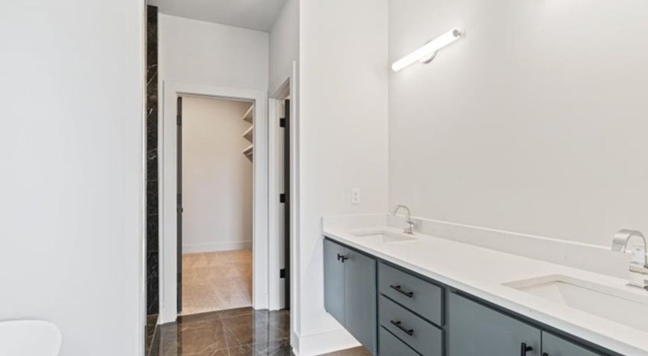  quartz counters open floor plan built in 2023 custom walk in closet ss appliances scored concrete floors